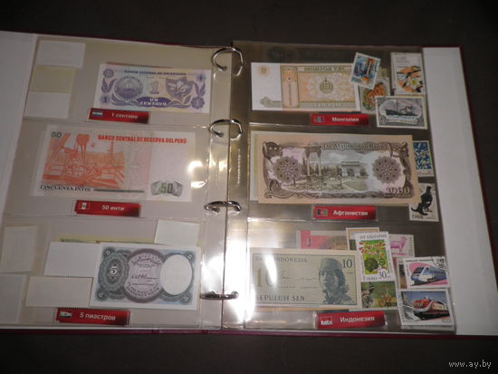 Папка Монеты и Банкноты на 20 листов и около 60 банкнот разных стран Мира.Новое!С рубля.