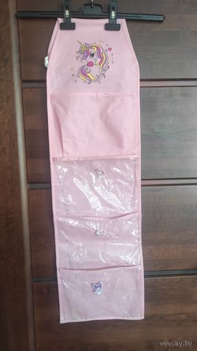 Конверт на дверь в шкаф на 4 ячейки, длина 87 см, ширина 26 см. Верх на резинке. Б/у, пользовались. Очень удобно для детского сада.