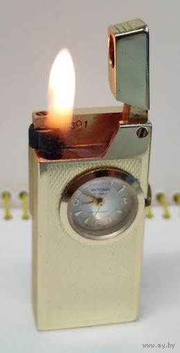 Редкая винтажная зажигалка пр-ва Swiss номерная,со встроенными механическими часами "Mitoma" За вашу цену!