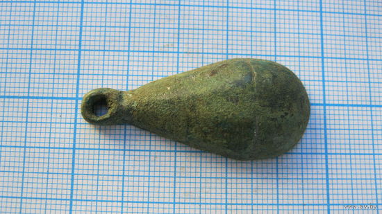 Половинка древней привески. Бронза, литье.