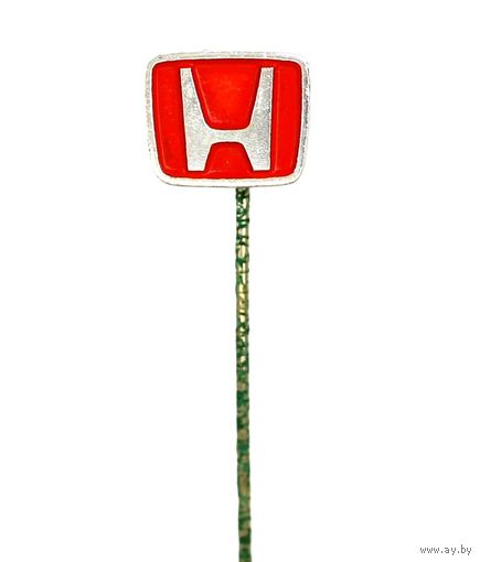 Значок с логотипом автомобильной компании Хонда